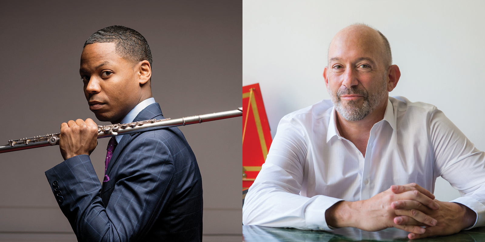 A man in a blue suit holds a flute on his shoulder. A man in a white shirt sits at a red harpsichord.